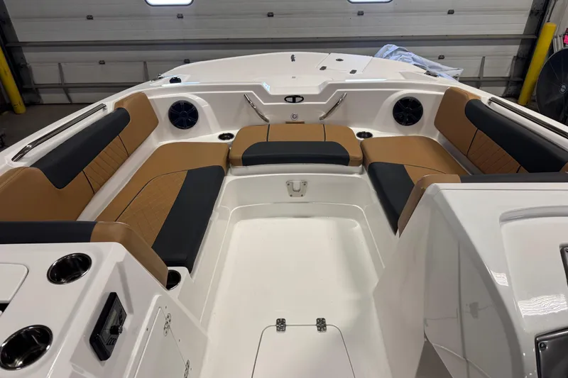 Slide: The Image of Interior of 2025 Tahoe 1950 boat with tan and black seating. - 8
