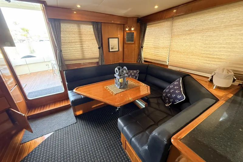 Slide: The Image of Luxurious 2003 Mikelson Sportfisher yacht interior with elegant seating and nautical decor. - 9