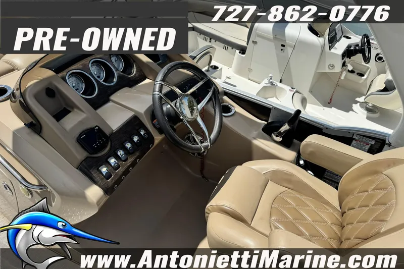 Slide: The Image of Pre-owned 2016 Bennington 2550 RS boat interior with steering wheel and controls. - 11