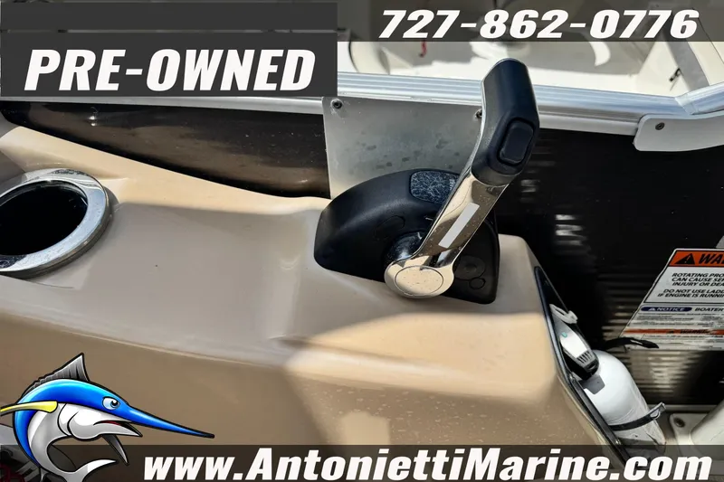 Slide: The Image of Pre-owned 2016 Bennington 2550 RS boat throttle control with contact details. - 17