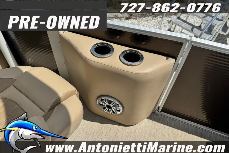 Slide: The Image of Pre-owned 2016 Bennington 2550 RS boat interior with cup holders and speaker. - 21