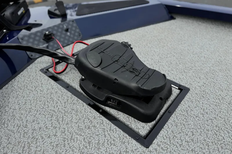Slide: The Image of 2024 G3 Sportsman 1710 boat foot pedal on textured deck surface. - 10