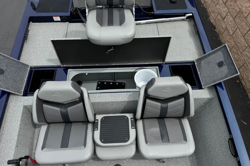 Slide: The Image of 2024 G3 Sportsman 1710 boat interior with gray seating and storage compartments. - 16