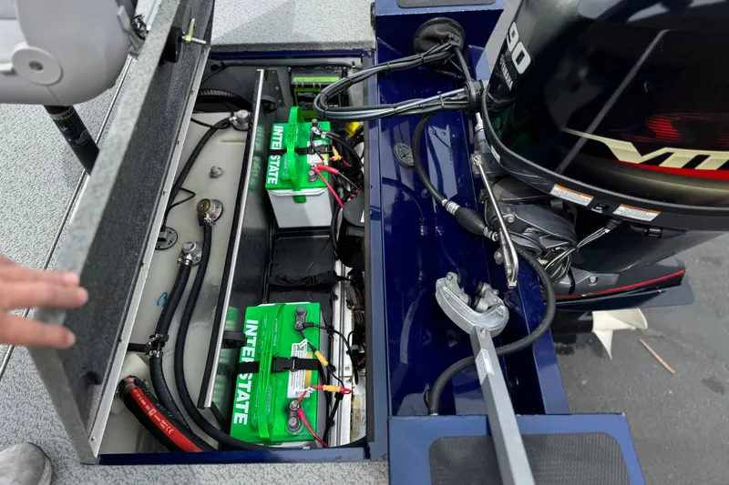 Slide: The Image of 2024 G3 Sportsman 1710 boat engine compartment with batteries and wiring. - 17