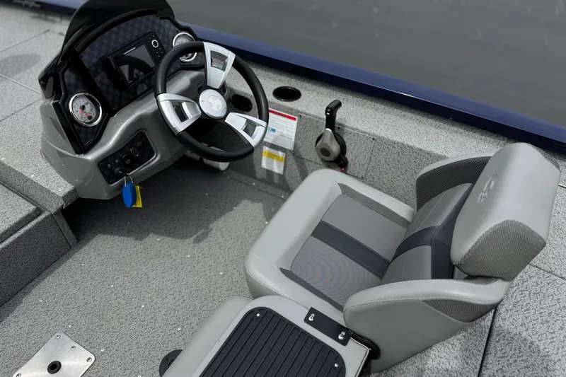 Slide: The Image of 2024 G3 Sportsman 1710 boat interior with steering wheel and seat. - 18