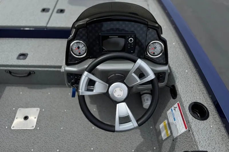 Slide: The Image of 2024 G3 Sportsman 1710 boat dashboard with steering wheel and gauges. - 19