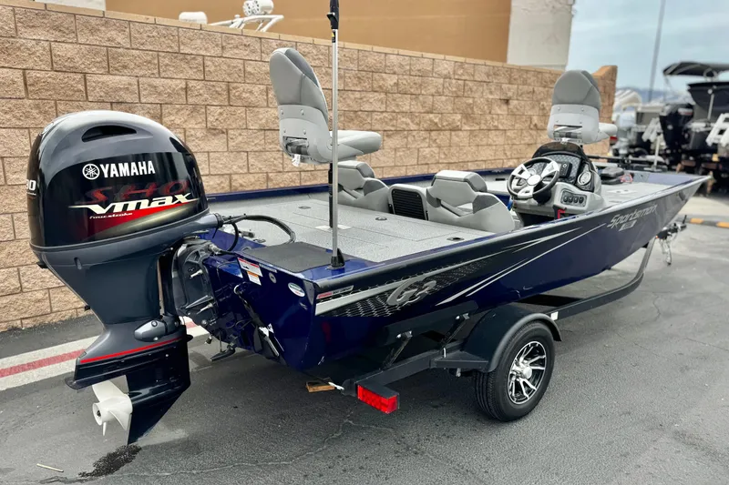 Slide: The Image of 2024 G3 Sportsman 1710 boat with Yamaha VMAX engine, parked outdoors. - 5