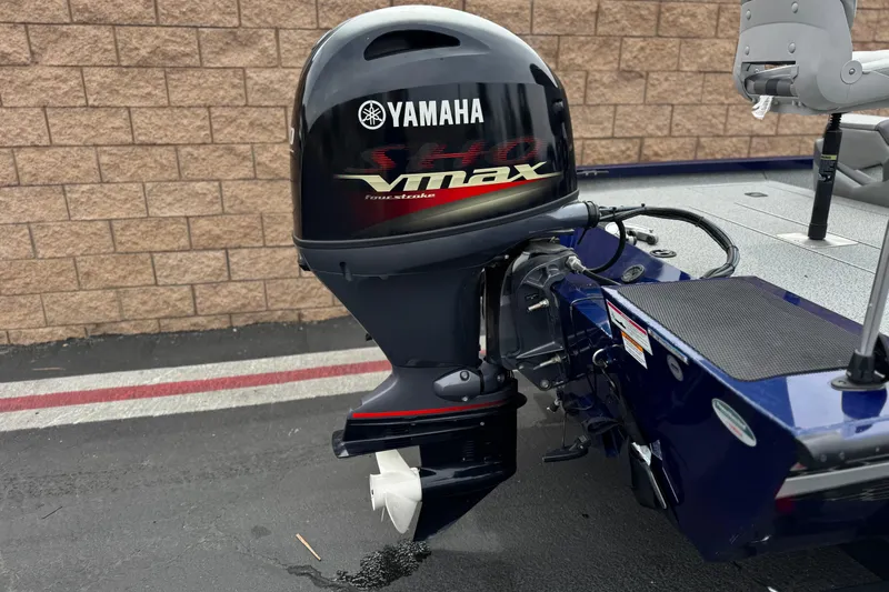 Slide: The Image of 2024 G3 Sportsman 1710 boat with Yamaha VMAX outboard motor, parked on pavement. - 6