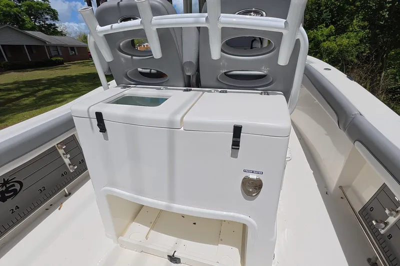 Slide: The Image of 2021 NauticStar 28 XS boat interior with seating and storage compartments. - 8