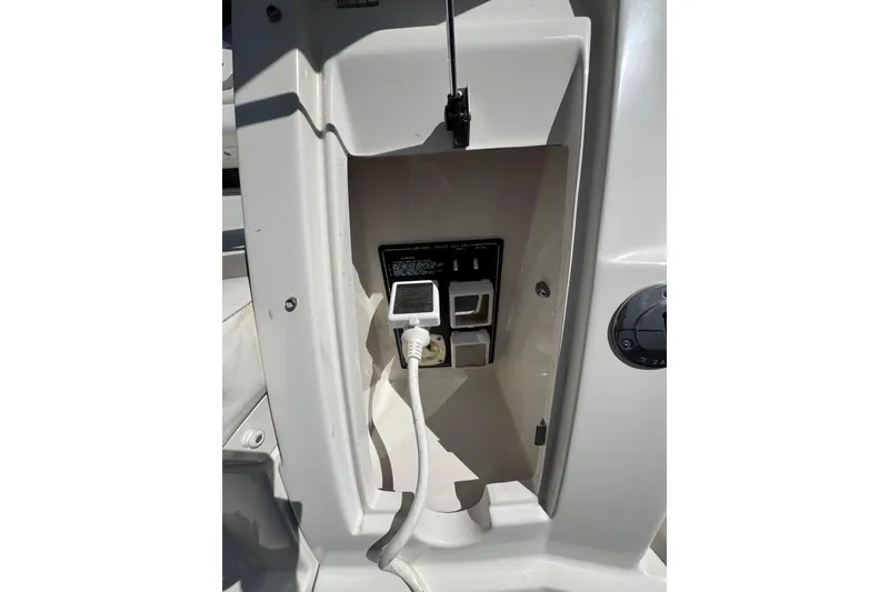 Slide: The Image of 2009 Monterey 320 Sport Yacht shower controls with open panel and warning label. - 18