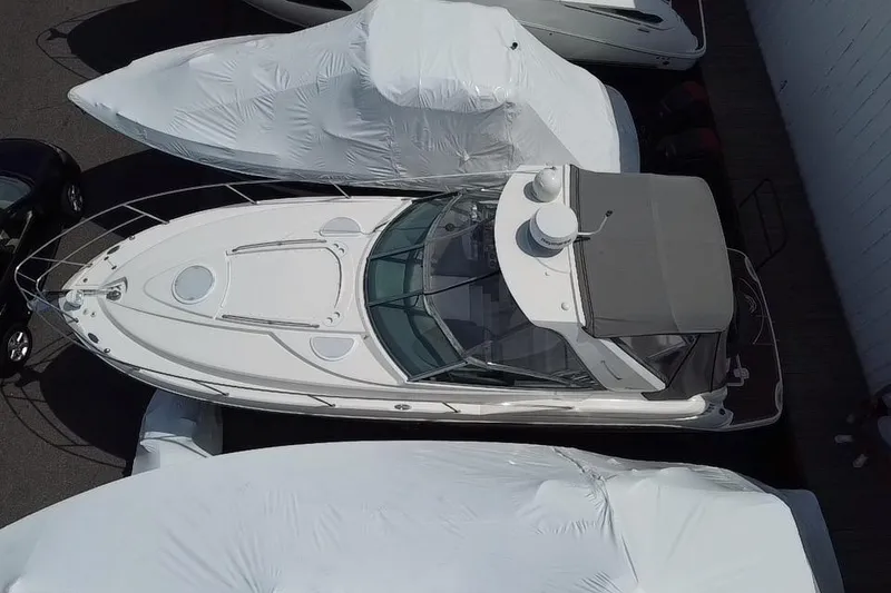 Slide: The Image of 2009 Monterey 320 Sport Yacht docked in marina, side view. - 2
