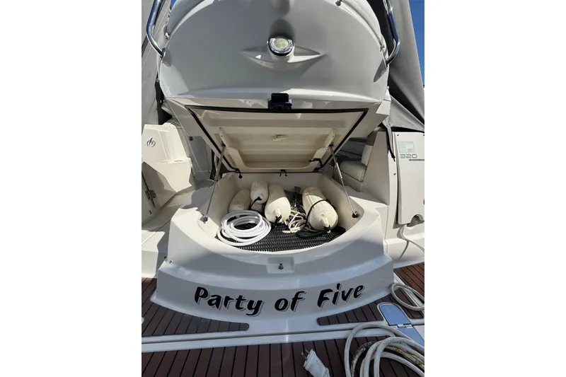 Slide: The Image of Interior of a 2009 Monterey 320 Sport Yacht, featuring helm and seating area. - 20