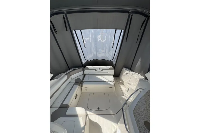 Slide: The Image of Open storage compartment on 2009 Monterey 320 Sport Yacht with visible contents. - 25