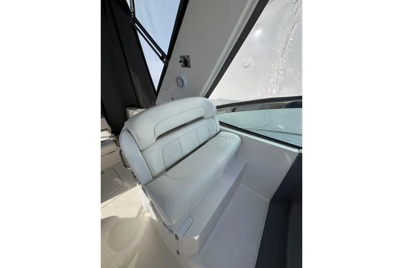 Slide: The Image of Storage compartment in a 2009 Monterey 320 Sport Yacht, featuring a sleek white interior. - 26