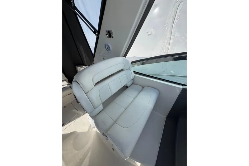 Slide: The Image of Storage compartment of a 2009 Monterey 320 Sport Yacht, featuring mounting brackets. - 27