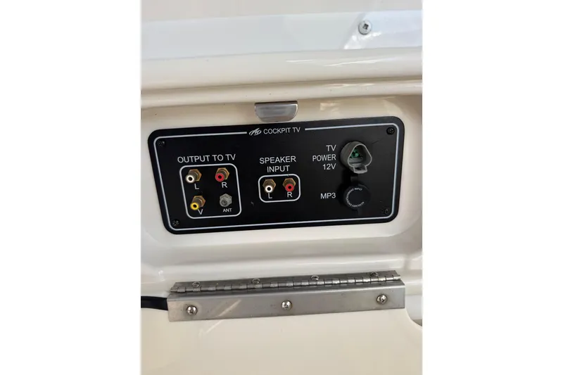 Slide: The Image of Interior view of a 2009 Monterey 320 Sport Yacht, featuring a compact refrigerator. - 32