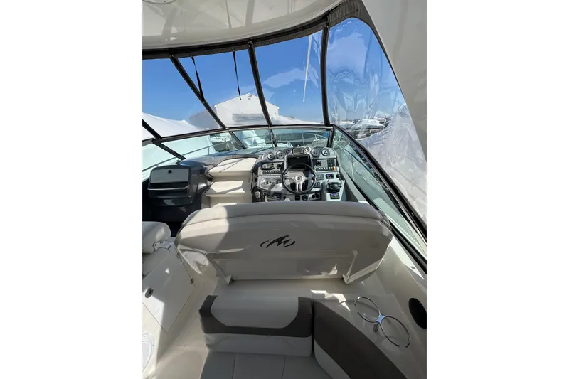 Slide: The Image of Cockpit view of 2009 Monterey 320 Sport Yacht with steering wheel and control panel. - 37