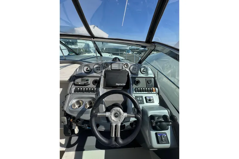 Slide: The Image of Control panel on a 2009 Monterey 320 Sport Yacht, featuring digital display and buttons. - 38