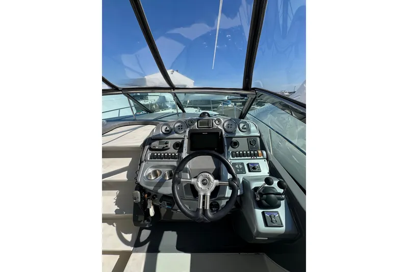 Slide: The Image of Interior view of a 2009 Monterey 320 Sport Yacht, showcasing storage compartment details. - 39