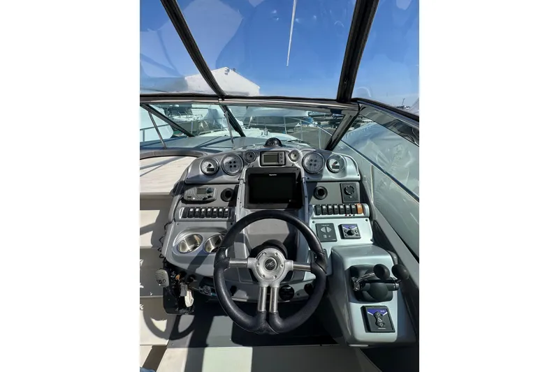 Slide: The Image of Luxurious interior of a 2009 Monterey 320 Sport Yacht with elegant seating and wood flooring. - 40