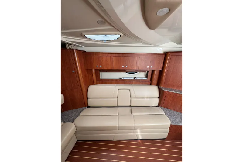 Slide: The Image of Interior cabin of 2009 Monterey 320 Sport Yacht with TV and wood paneling. - 46