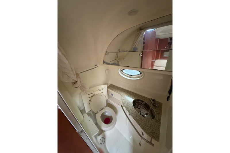 Slide: The Image of Interior of 2009 Monterey 320 Sport Yacht with beige seating and wood flooring. - 56