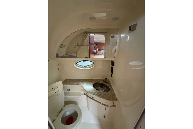 Slide: The Image of Interior cabin of 2009 Monterey 320 Sport Yacht with beige seating and wooden flooring. - 57