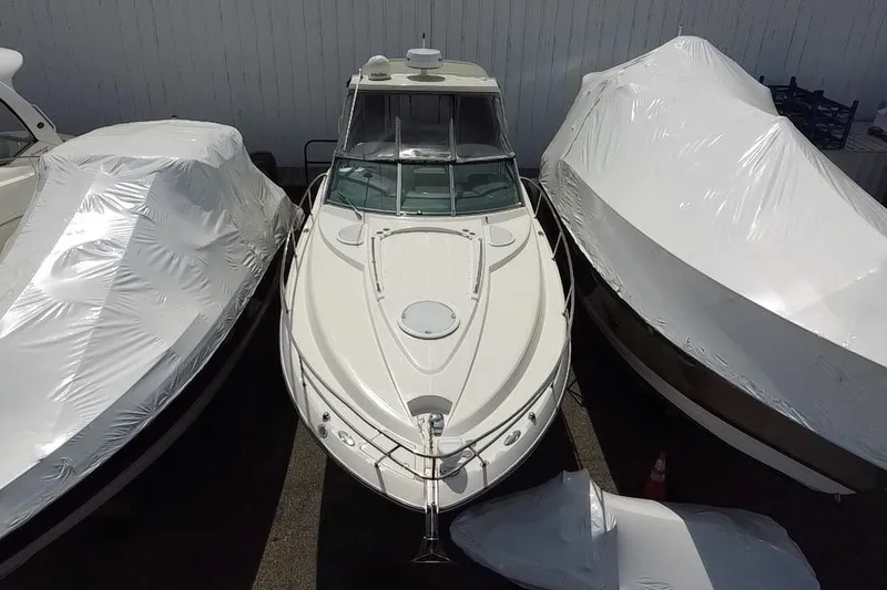 Slide: The Image of 2009 Monterey 320 Sport Yacht on dry dock under clear blue sky. - 9