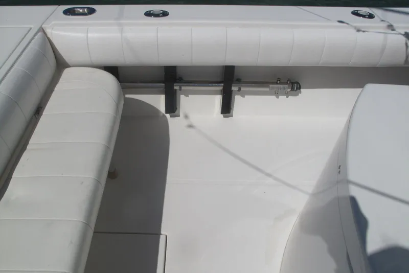 Slide: The Image of 2013 Regulator 32 Forward Seating boat interior with white cushioned seating. - 34