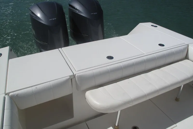 Slide: The Image of 2013 Regulator 32 Forward Seating boat with twin outboard motors and cushioned seating. - 35