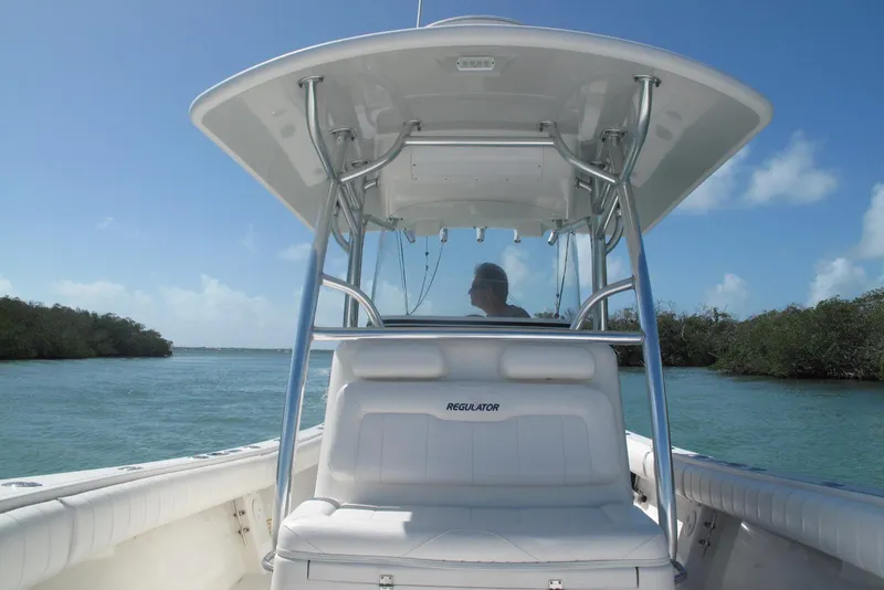 Slide: The Image of 2013 Regulator 32 Forward Seating boat cruising on a sunny day. - 36