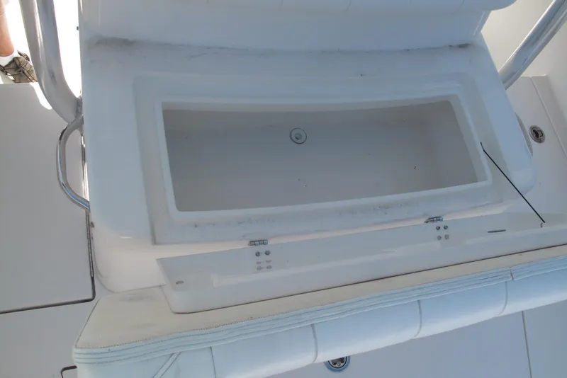 Slide: The Image of 2013 Regulator 32 Forward Seating boat storage compartment, open and empty. - 4