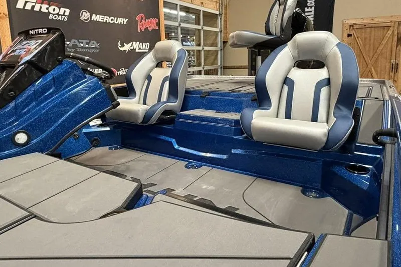 Slide: The Image of 2026 Nitro Z20 XL Pro boat interior with blue and gray seating. - 11