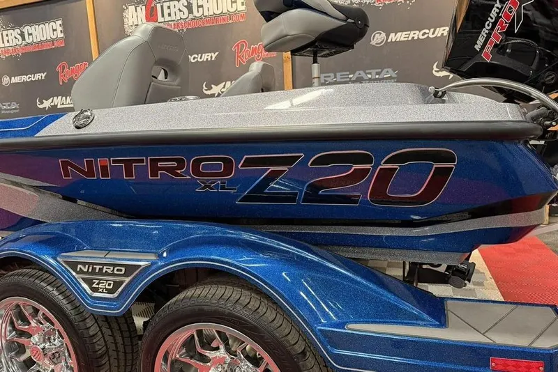 Slide: The Image of 2026 Nitro Z20 XL Pro boat, blue exterior, displayed at Anglers Choice event. - 13