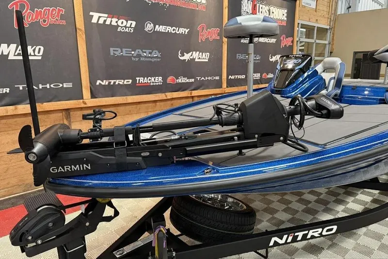 Slide: The Image of 2026 Nitro Z20 XL Pro boat with Garmin equipment, displayed indoors on a trailer. - 3