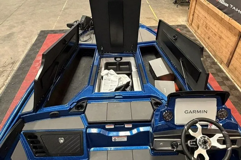 Slide: The Image of 2026 Nitro Z20 XL Pro boat interior with Garmin system and storage compartments open. - 5