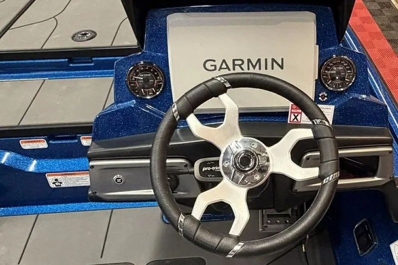 Slide: The Image of Steering wheel and Garmin display on 2026 Nitro Z20 XL Pro boat dashboard. - 6