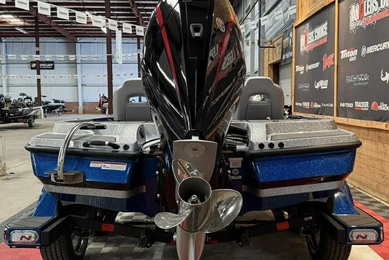 Slide: The Image of 2026 Nitro Z20 XL Pro boat in showroom, rear view with powerful engine. - 8