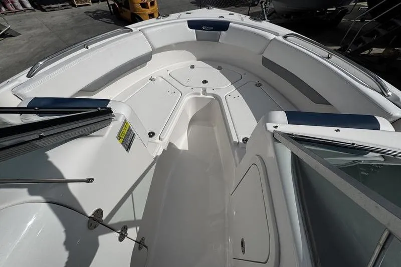 Slide: The Image of 2021 Robalo R227 Dual Console boat interior with spacious seating and storage compartments. - 6