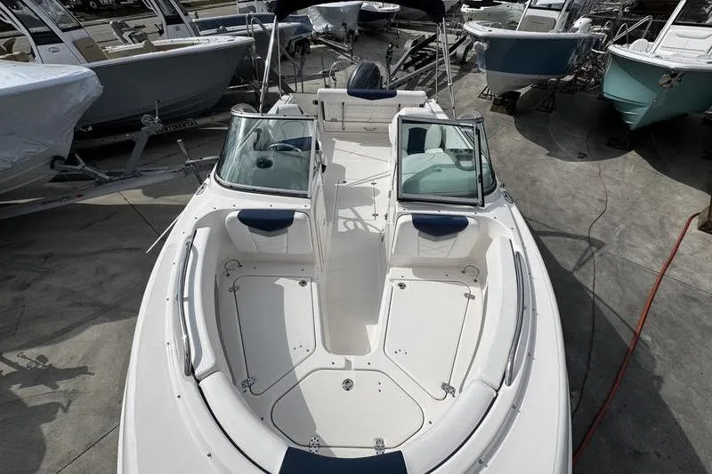 Slide: The Image of 2021 Robalo R227 Dual Console boat with spacious seating and sleek design. - 7