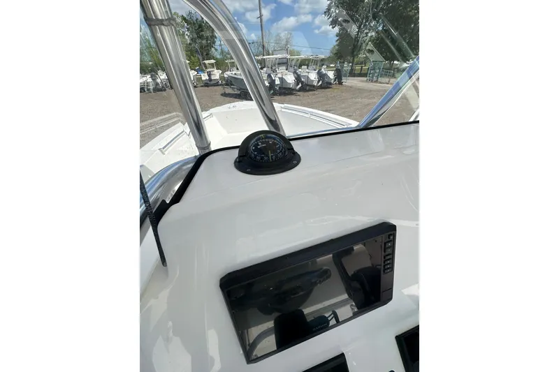 Slide: The Image of 2023 LFG 22CC boat dashboard with compass and navigation screen. - 12