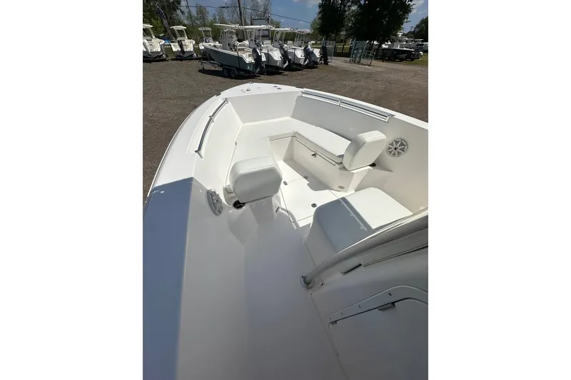 Slide: The Image of 2023 LFG 22CC boat interior with white seating and spacious deck. - 13