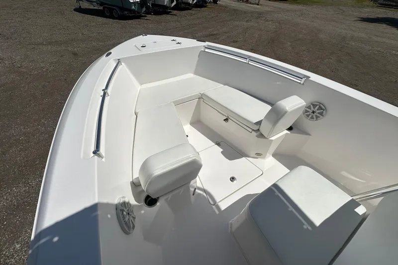 Slide: The Image of 2023 LFG 22CC boat interior with white seating and storage compartments. - 14