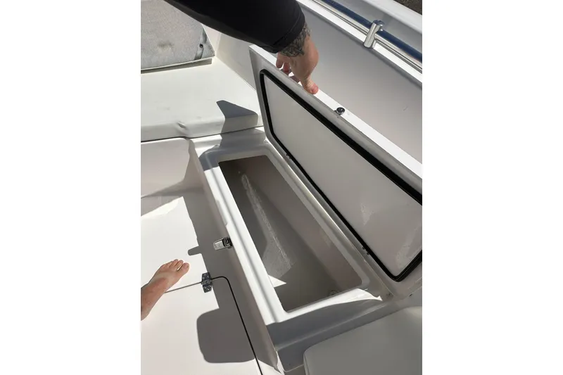 Slide: The Image of Open storage compartment on 2023 LFG 22CC boat, showcasing interior space. - 18