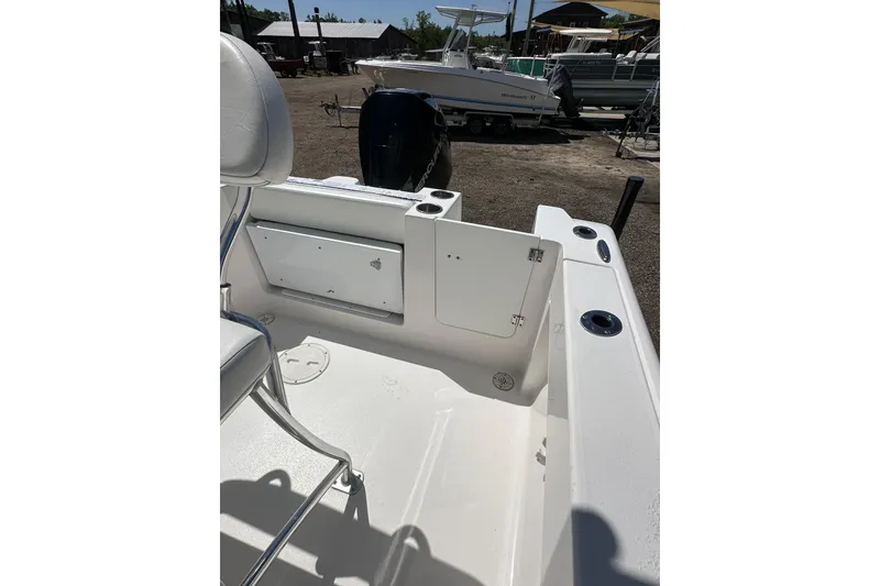 Slide: The Image of 2023 LFG 22CC boat interior with open storage compartment and seating. - 21