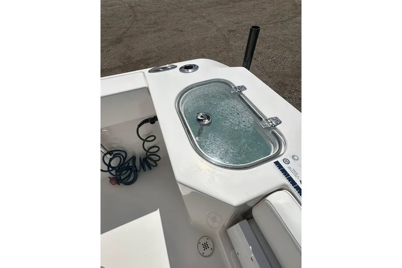 Slide: The Image of 2023 LFG 22CC boat with livewell and coiled hose on deck. - 24