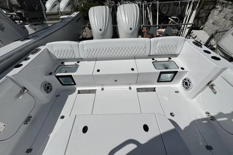 Slide: The Image of 2026 Sportsman Heritage 321 Center Console boat interior with seating and storage compartments. - 22