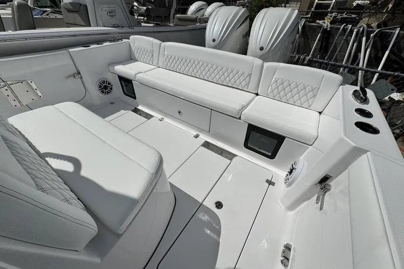 Slide: The Image of 2026 Sportsman Heritage 321 Center Console boat with white seating and modern design. - 23