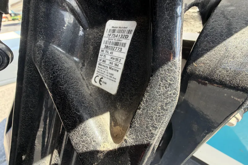 Slide: The Image of Close-up of a 2021 Bayliner Element E16 engine label with specifications. - 19