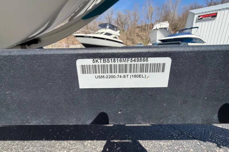 Slide: The Image of 2021 Bayliner Element E16 boat trailer with visible barcode and identification label. - 23